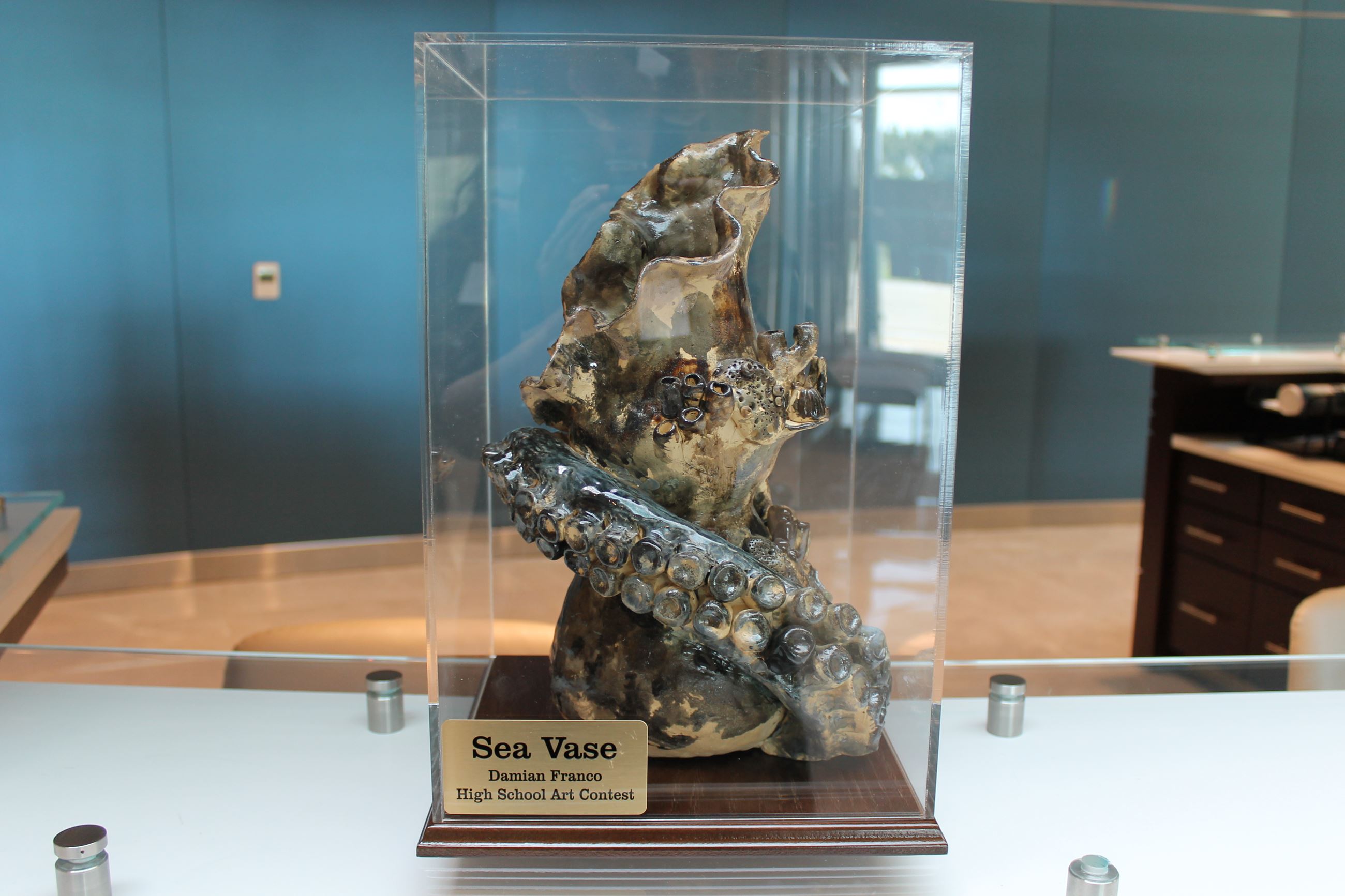 Picture of a vase with elements of sea life carved into it