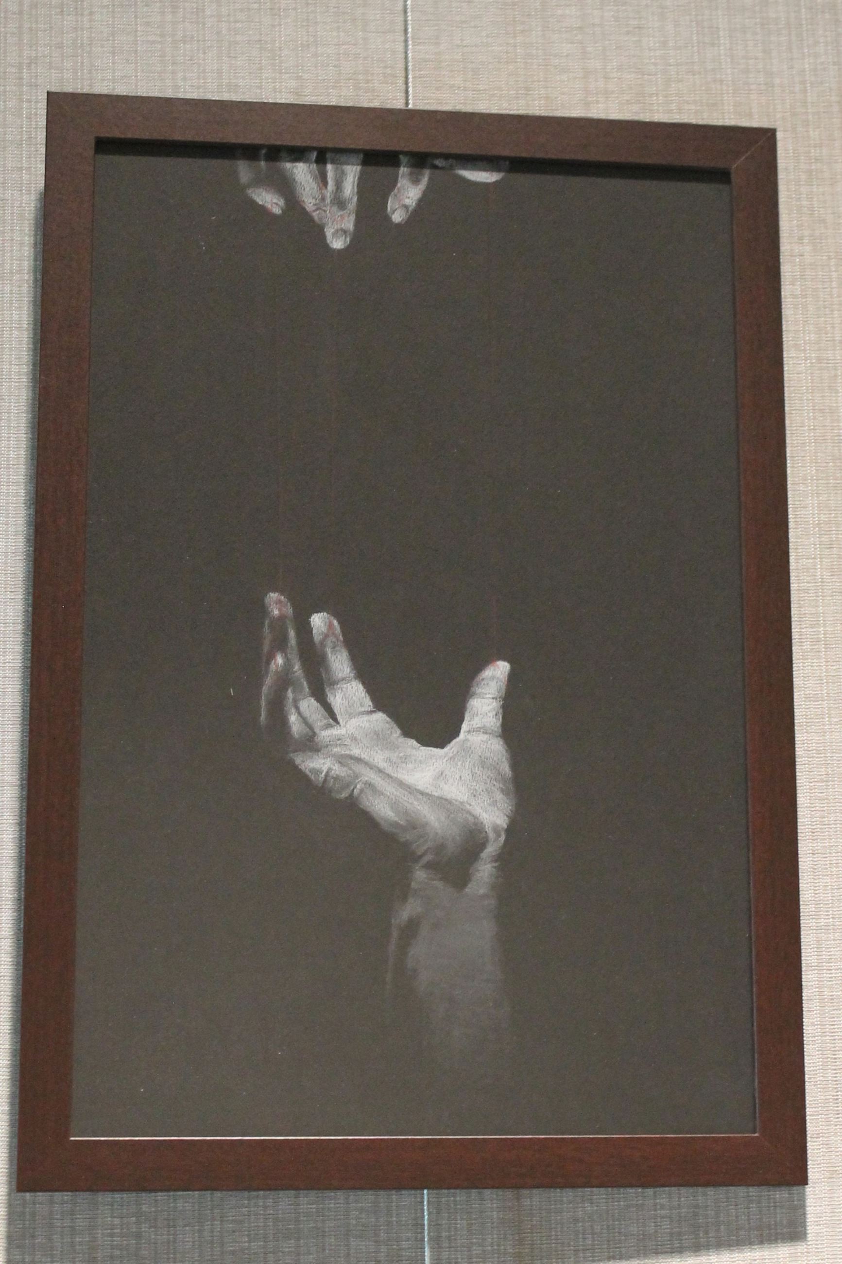 Picture of a drawing of vertical hands reaching towards each other