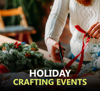 Person cutting holiday ribbon surrounded by garland